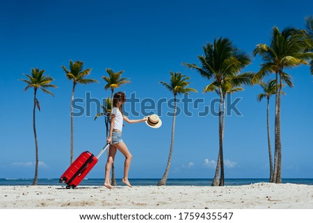 Woman with a suitcase on vacation