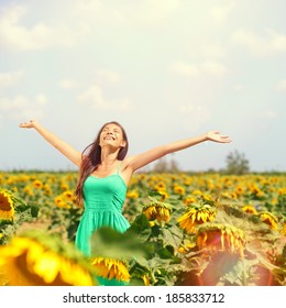 Woman Summer Girl Happy In Sunflower Flower Field. Cheerful Multiracial Asian Caucasian Young Woman Joyful, Smiling With Arms Raised Up.