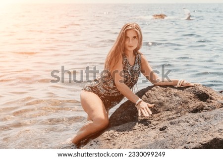 Similar – Young, long-legged woman sitting on the Baltic Sea beach