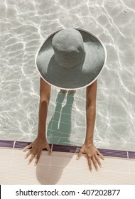 Woman In Sun Hat In The Swimming Pool. Top View. Vintage Style.