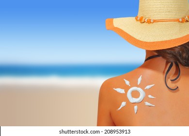 Woman With Sun Shaped Sunscreen On Her Back