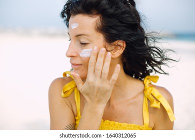 Woman With A Suncream On Her Face