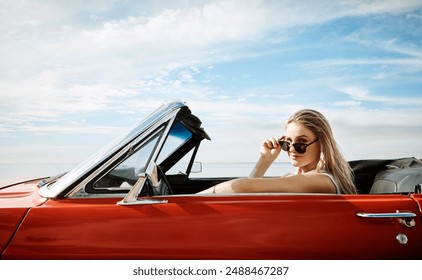 Woman, sunglasses and driving convertible for road trip, adventure and freedom with holiday or vacation alone. Portrait of young driver with cool, trendy and new car for outdoor journey and travel - Powered by Shutterstock