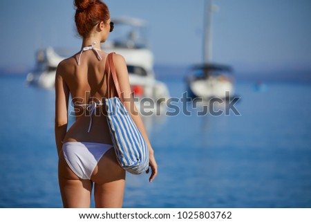 woman with sunglasses of marina on hot summer day