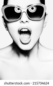 woman in sunglasses with opened mouth
