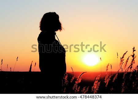 Similar – Sonnenuntergang, Rückenansicht Frau, Feld