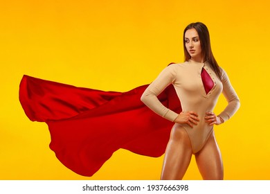 Woman Super Hero. Sporty Fit Woman, Athlete Posing On Yellow Background.