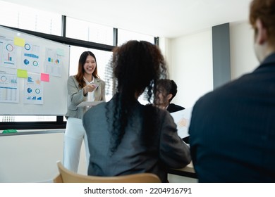 Woman Supervisor Boss Teach Diverse Staff Workers Explain Project Plan Paperwork At Group Meeting, Focused Black Female Mentor Training Business Team At Corporate Office Briefing.