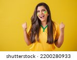 Woman supporter of Brazil, football championship, screaming goal, celebrating team victory and goal.