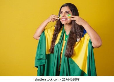 Woman Supporter Of Brazil, Football Championship, Putting Paint On Her Face.