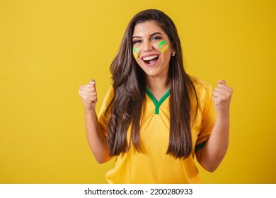 Woman supporter of Brazil, football championship, screaming goal, celebrating team victory and goal. - Shutterstock ID 2200280933