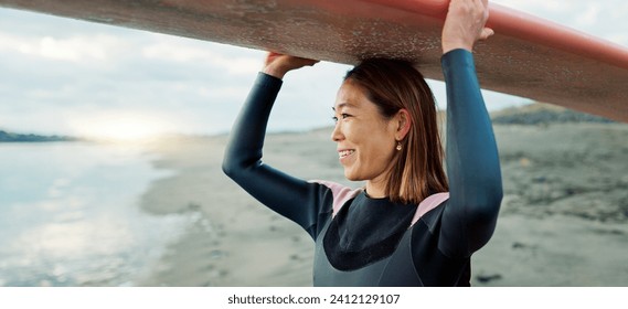 Woman, surfer with surfboard at beach and view of ocean, nature and extreme sports for fitness. Asian, athlete and smile for exercise and surfing at sunrise, workout or training for hobby outdoor - Powered by Shutterstock