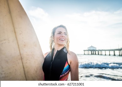 Woman Surfing In The Ocean