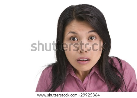 A woman is surprised and have funny expression. Shot against white background.