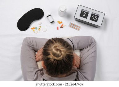 Woman Surrounded By Different Pills On White Bedsheet, Top View. Insomnia Treatment