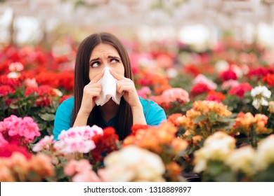 Woman Surrounded By Flowers Suffering From Allergies. Blooming Decorative Plants Acting As Allergens In Spring Time
