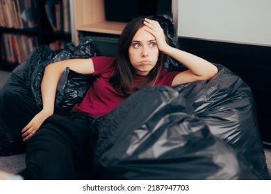 
Woman Surrounded with Plastic Bags after De-cluttering and Editing her Wardrobe. Unhappy fashionista feeling guilty for irresponsible over consumption of fast fashion
 - Shutterstock ID 2187947703