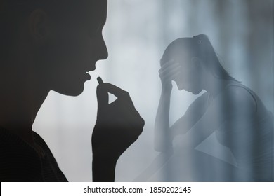Woman swallowing medication pill. People drug addiction, sickness and mental depression concept. 
