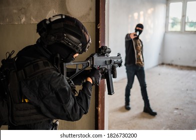 Woman Swat Police Officer Arresting A Criminal Guy With A Gun.