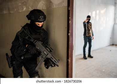 Woman Swat Police Officer Arresting A Criminal Guy With A Gun.