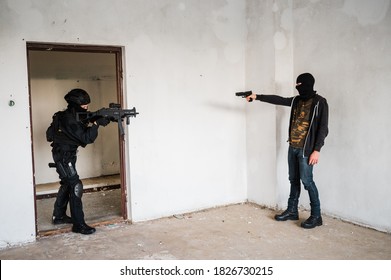 Woman Swat Police Officer Arresting A Criminal Guy With A Gun.