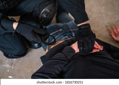 Woman Swat Police Officer Arresting A Criminal Guy With A Gun.