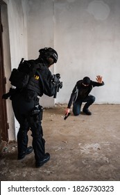 Woman Swat Police Officer Arresting A Criminal Guy With A Gun.