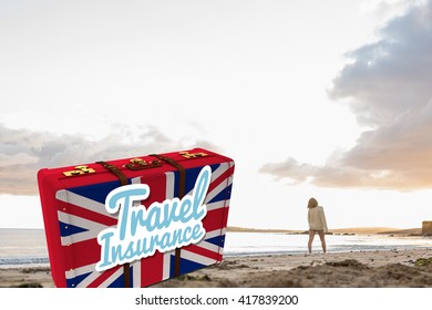 Woman in sweater walking on beach against travel insurance message on a british suitcase - Powered by Shutterstock