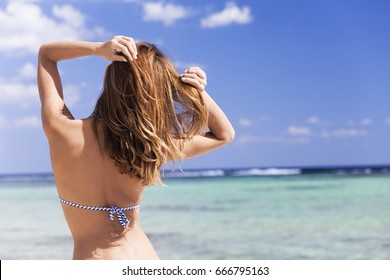 Woman In Swim Suit In Front Of The Sea