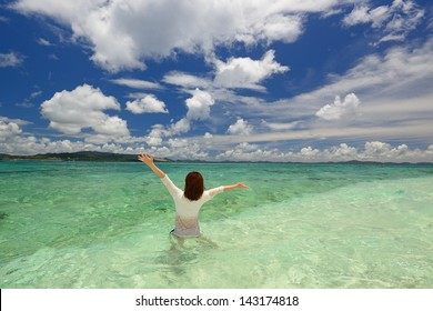 Woman Swiming At The Beach