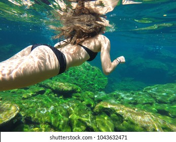 Woman Swiming On Cenote