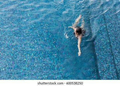 Woman Swiming In The Swiming Pool View From Above