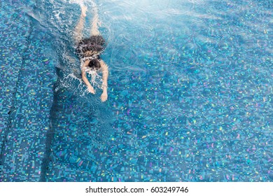 Woman Swiming In The Swiming Pool View From Above