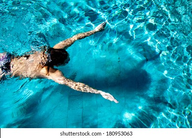Woman swimmer with shadow and halo