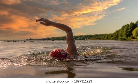 Woman Swimming In A Lake