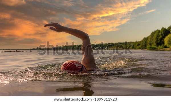 Woman swimming in a\
lake