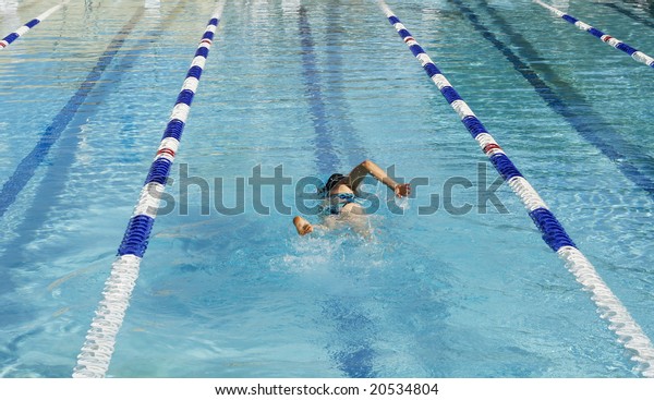 woman swimming laps in\
pool
