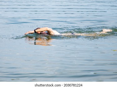 Woman Swimming In Open Water Lake