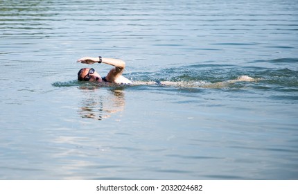 Woman Swimming In Open Water Lake