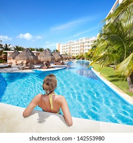 Woman In Swimming Pool At Caribbean Resort. Vacation.