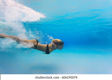 Woman At Swimming Pool Underwater