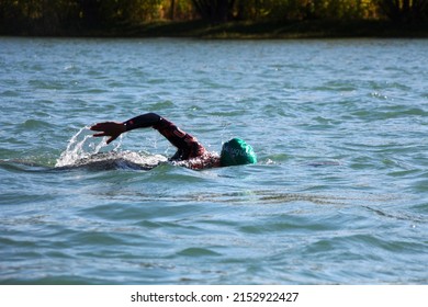 Woman Swimming In A River, Open Water Competition, Triathlon.