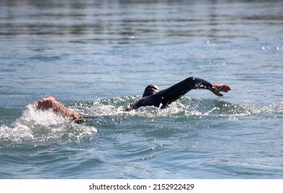 Woman Swimming In A River, Open Water Competition, Triathlon.