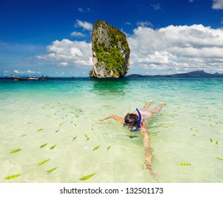 Woman swimming with snorkel, Andaman Sea, Thailand - Powered by Shutterstock