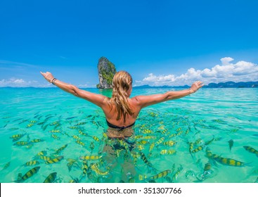 Woman Swimming With Snorkel Surrounded By Fish, Andaman Sea, Thailand