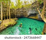 Woman swimming in Tulum Cenotes That Are Worth a Visit, Cenotes around tulum and playa del carmen that deserve a visit at least once. Mexico world tourist place