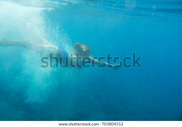 Woman Swimming Underwater Blue Transparent Sea Stock Photo 703804552