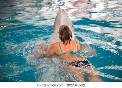 Woman Swims With Dolphin In Dolphinarium