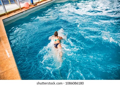 Woman Swims With Dolphin In Dolphinarium