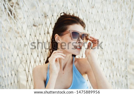 Similar – Young surfer woman with top and bikini kissing surfboard